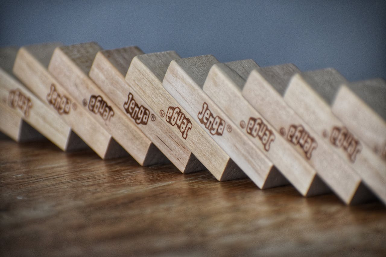 Artistic close-up of aligned Jenga blocks on a table, showcasing craftsmanship and balance.